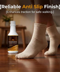 Hassle Free Wood Floor Restorer And Hardwood Scratch Repair Slicks Up Dull Surfaces Without Sanding Quick Revitalizer For Smooth Flooring And Wooden Furniture A No Sweat Quick Fix bottle beside feet on polished wood floor.