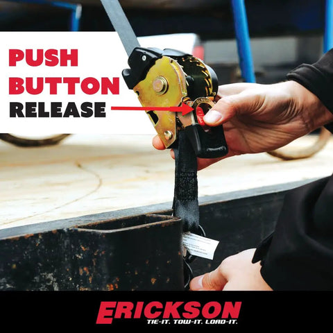 Detail of No Nonsense Retractable Ratcheting Tie Down Straps 2 Pack Black showing push button release mechanism in use.