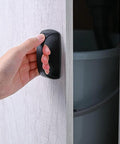 Hand pulling open cabinet with 2 Pack Self Stick Wardrobe Handles With Adhesive For Cabinets Drawers And Doors, black adhesive handle