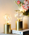 Battery Operated LED Lantern With Metal Cage 8 Inch 10 Inch Round Lamp USB Powered 6 Hour Timer, glowing light on table
