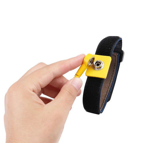 Hand holding Anti Static Wrist Strap Kit With 11 Inch Grounding Wristband and Alligator Clip, black and yellow band