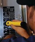 Person using PolyStinger LED HAZ-LO Intrinsically Safe Rechargeable Flashlight Beast Bright Yellow, 130 Lumens in electrical panel