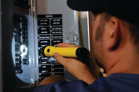 Person using PolyStinger LED HAZ-LO Intrinsically Safe Rechargeable Flashlight Beast Bright Yellow, 130 Lumens in electrical panel