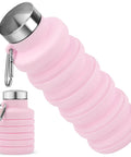 Collapsible 16oz Silicone Water Bottle With Carabiner For Gym Travel Camping Hiking Sports Lightweight BPA Free Leak Proof Foldable Design Light Pink TSA Friendly Travel Ready displayed with stainless steel lid and carabiner.