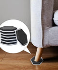 Total Game Changer 20 Pack Heavy Duty Furniture Sliders For Smooth Carpet Moves, hexagon shape under couch leg on hardwood floor.
