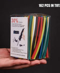 Hand holding clear box with 162 pieces of Two To One Heat Shrink Tubing Set With Flame Retardant V0 Rating, Nine Colors, Six Diameters
