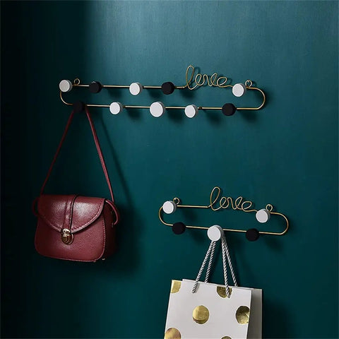 Top Tier Wrought Iron Love Wall Hooks For Bedroom And Living Room Smooth Metal Coat Rack Heavy Duty Entryway Key Holder Gear Setup Solid European Home Decor Accent with bags on decorative hooks.