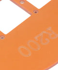 Close-up of Two Piece Woodworking Corner Radius Template Kit With Router Jig Covering R15 To R200 showing orange plastic material with cutouts.
