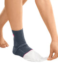 Person wearing Knit Achilles Ankle Support Brace For Men And Women With Silicone Inlays And Dual Heel Wedges, Silver