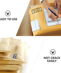 Person sealing Beige Kraft Bubble Mailers With Self Seal Closure, Bubble Lined And Sturdy Padded Envelopes For Safe Shipping, Pack Of 25