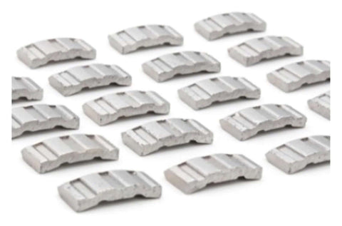 Top view of multiple gray turbo diamond concrete segments, rectangular blocks for core drill bits.