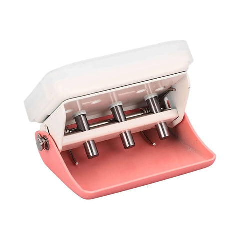 Three Hole Punch Handheld Paper Puncher With Five Sheet Capacity And Alignment Posts for B5 A5 A4 A6 A7, pink metal, angled view