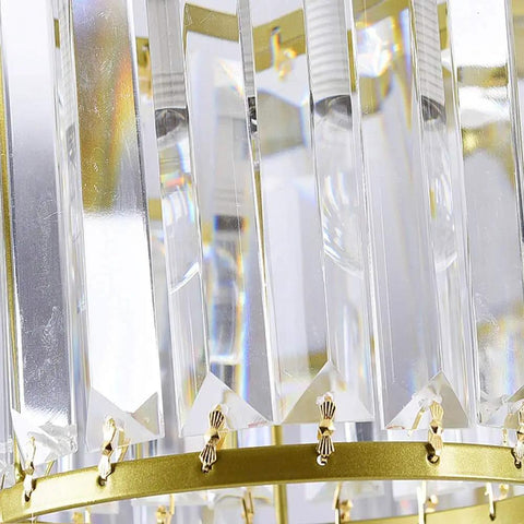 Close-up of Modern Ceiling Pendant Light Featuring Transparent Crystal And Polished Gold Cylinder Frame showing crystal details.