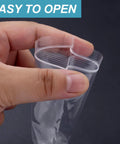 Hand holding a Clear Zip Bag 4 By 6 Inch Pack Of 200 Reclosable Plastic Bags 2 Mil Thick Food Grade Safe Mini Baggies