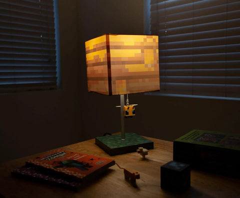 Pixelated Yellow Bee Nest Block Desk Lamp With 3D Bee Puller And LED Mood Light For Bedroom Desk Playroom Pixel Gaming Decor For Kids Room Nightstand Accent That Is Totally Lit illumines a dim desk with pixel art shade.