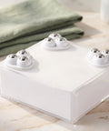 12pcs Furniture Caster Wheels, 360 Degree Swivel Self Adhesive on a clear container with metal balls for easy movement.