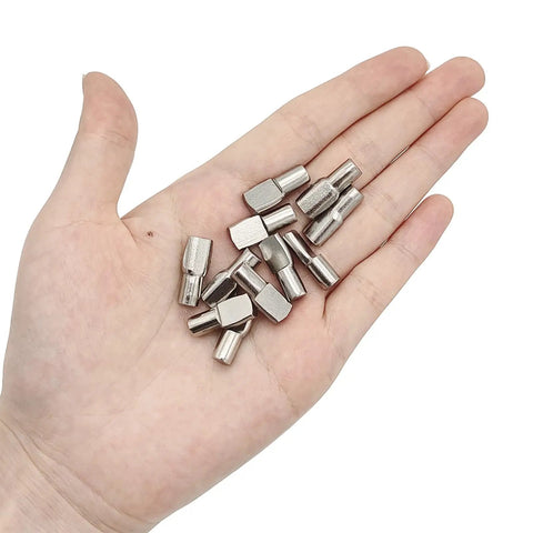 22 Pack Heavy Duty Nickel Plated Shelf Support Pegs For Home Storage, 1/4 Inch Spoon Style Cabinet Pin Holders in hand.