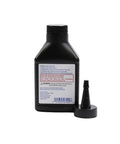 Street Tested Pro Grade Limited Slip Differential Additive Slick Smooth Rear End Lube Cuts Friction And Axle Whine Heavy Duty American Built Gear Guard Four Ounce in a black bottle with a spout.