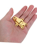 Zerodeko Metal Duckbilled Hasp Lock Toggle Latch Zinc Alloy Material 2pcs held in a hand showcasing its gold finish and design.