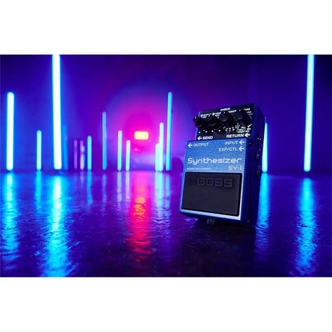 SY-1 Guitar and Bass Synth Pedal With Polyphonic Synth Engine, Hold Function pictured on a stage with blue neon lights