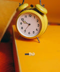 Vintage Grandpa Clock Repair Weight Kit With Shell Hook And Nut Replacement Parts M5 on orange surface with a yellow clock