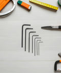 Top Notch 7 Piece Mini Metric Hex Key Wrench Set From 0.7 To 3.0mm Compact Metal Tool Kit Perfect For Precision Electronics Repair Bike Maintenance And Crafting Projects On The Go, seven black L-keys on white surface