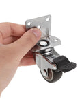 Hand holding 4 Pack One And A Half Inch Side Mount Quiet Furniture Caster with Locking Brake TPR Rubber for Tables Desks Chairs Hospitals