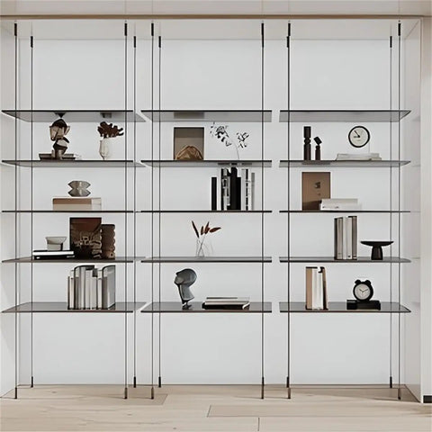 Sleek Black Four Tier Wall Mounted Storage Rack With Solid Aluminum Alloy Shelves For Living Room Decor displaying books and decor items.