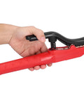 Heavy Hitter Welding Electrode Clamp, 1000A Copper Jaw Stinger with rubberized grip, held in hand, adjustable angle.