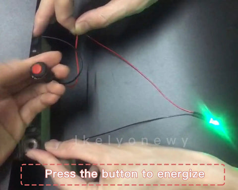 Person demonstrating 12mm Mini Latching Push Button On Off Switch With Prewired 2 Pin 12V Wires Red And Green 6 Pieces Each Total 12 Pieces.