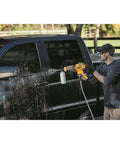 Man using Cordless Pressure Washer Power Cleaner 550 PSI 1.0 GPM Tool Only No Battery Or Charger Included Grab And Go Cleaning to wash truck