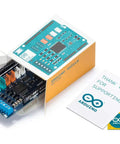 Dual H-Bridge Motor Shield Rev 3 in packaging with Arduino cards, for four DC motors or two stepper motors, 1.2A per channel.