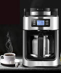 Legit Automatic Drip Coffee Maker With Built In Burr Grinder Smart Temp Control Programmable Timer with steaming coffee cup.