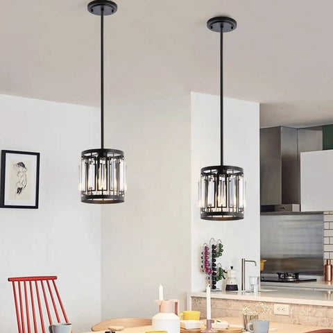 Four Light Farmhouse Pendant Chandelier For Dining Room And Kitchen Island Modern Black Crystal Lights Over Table E26 Base Fixture Durable K9 Crystals With Stainless Steel Rustic Yet Sleek Kitchen Lighting in a modern kitchen setting.