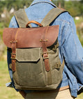 Person wearing DSLR Camera Backpack Waterproof Canvas With Removable Dividers For Travel And Outdoor Shooting Scratch Proof Gear Loadout