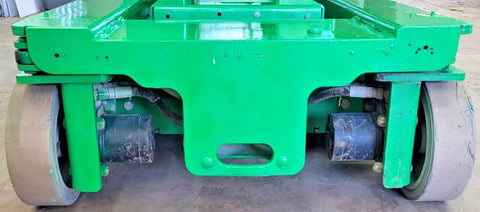 2016 Compact Self Propelled Electric Vertical Mast Lift Featuring Slick Drivability At Full Height Smooth Handling, showing the base and wheels.