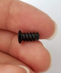 Top Tier 100 Piece Pack Of PC Computer Cooling Fan Mount Screws In Slick Black Finish Featuring Foolproof M5 X 10 Millimeter Threading held in hand.