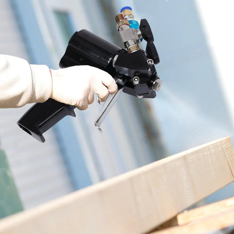Heavy Duty PU Foam Spray Gun Featuring Slick Pneumatic Trigger And Self Cleaning Design, held in gloved hand.