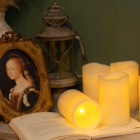 Flickering Flameless LED Candles Real Wax Pillar Set Of 6 with ambient glow, displayed next to vintage décor, battery operated