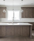 Pro Grade Reactive Water Based VOC Free Wood Stain For Pine Delivers A Sweet Rustic Weathered Gray Brown Look With Zero Sweat Application covering kitchen cabinets and island.