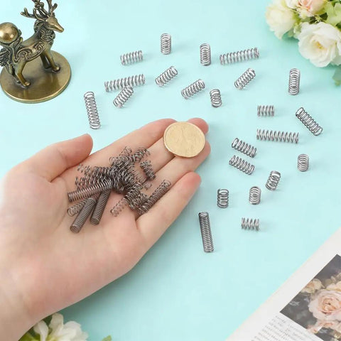 Get This Bad Boy AHANDMAKER 390pcs Stainless Steel Compression Springs Bulk Deal Assortment Kit For Home, Industrial Mechanical Repair Shop Maintenance And DIY Crafts Projects With Various Sizes From 11mm To 26.5mm That Will Make Your Garage Game Pop And. stainless steel compression springs, mixed sizes, shown with coin