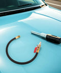 Top Rated Premium Boss Level European Cylinder Pressure Hose Rubber Alloy For Engine Leak Test Quick Connect No Leak Setup Fits Air Compressor And Auto Diagnostic Tools Easy Install Heavy Duty Performance For Garage Crew black rubber hose with brass quick-connect on car hood