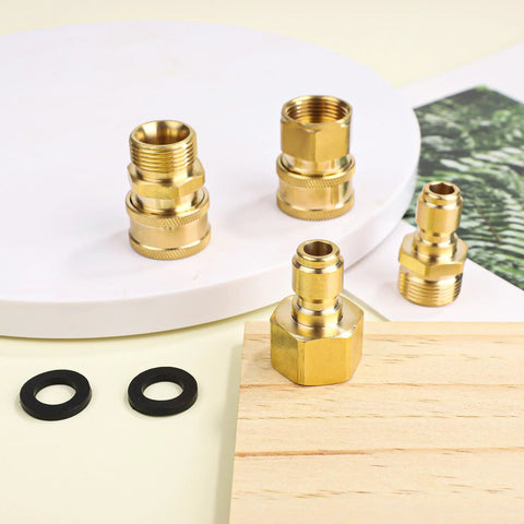 Four brass pressure washer adapters (M22-14mm to 3/8in) with black rubber washers.
