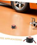Low Key No Stress Automatic Aerosol Fire Extinguisher 2 Pack With Heavy Duty Back Adhesive Auto Extinguishing Patch For Engine Bay Vehicle Fire Suppression And Garage Safety Gear on the floor near a vehicle tire.