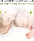 Mother and baby sleeping on a cloth washable, durable, soft, and breathable surface for a healthier environment.