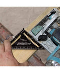 EZ Read 4.5 Inch Aluminum Carpenter Square With Glare-Resistant Finish on wood next to saw, CNC Machined For Durability, Black Finish