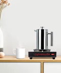 Professional Stainless Steel Coffee Warmer Plate, 80W Electric Mug Heater For Desk And Home on a wooden surface with a steaming mug.