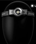 Rechargeable 1000 Lumen Headlamp With Bluetooth App Control on black mannequin head, showcasing front LED light design.