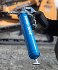 Heavy Duty Pistol Grip Grease Gun With Patented LockNLube Coupler Locks On And Does Not Leak, 20 Inch Hose shown in use outdoors