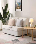 Modern White Ceramic Table Lamp With Irregular Geometric Base And White Fabric Shade on round table in living room setup